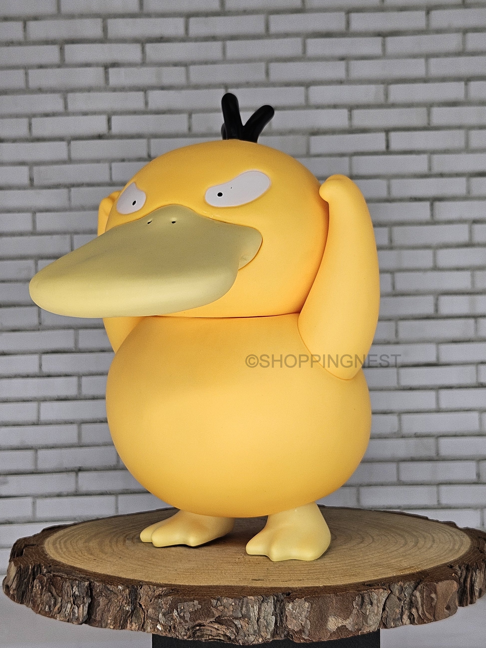 Psyduck actiom figure with left side look image 