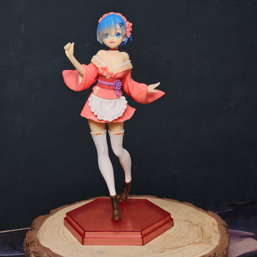 SAKURA Anime character figurine on a wooden stand against a dark background
