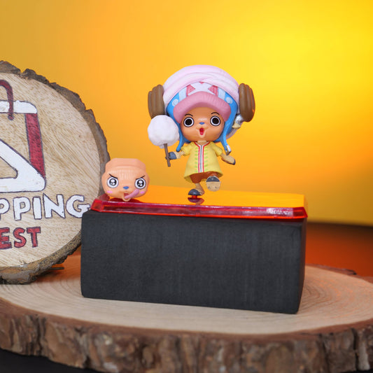 TONY CHOPPER FIGURE LEFT SIDE on a reflective surface with a 'Shopping Nest' sign in the background.