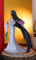 Figurine of a character in a white dress with long black hair against a colorful background
